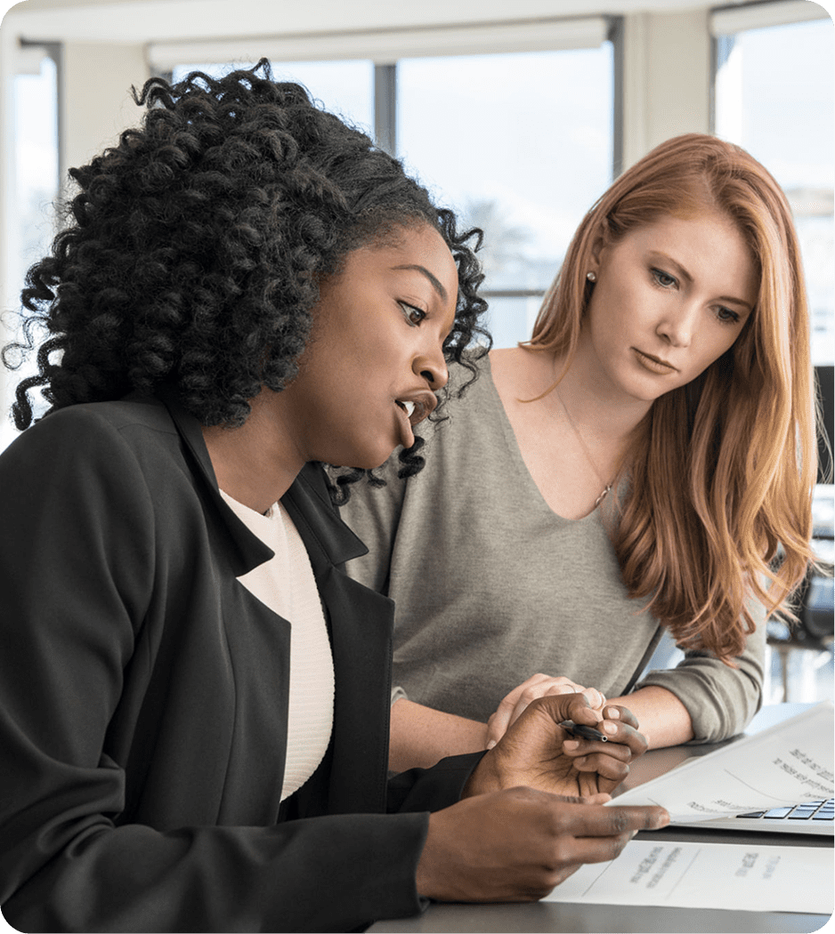 Two women collaborating on a business project.