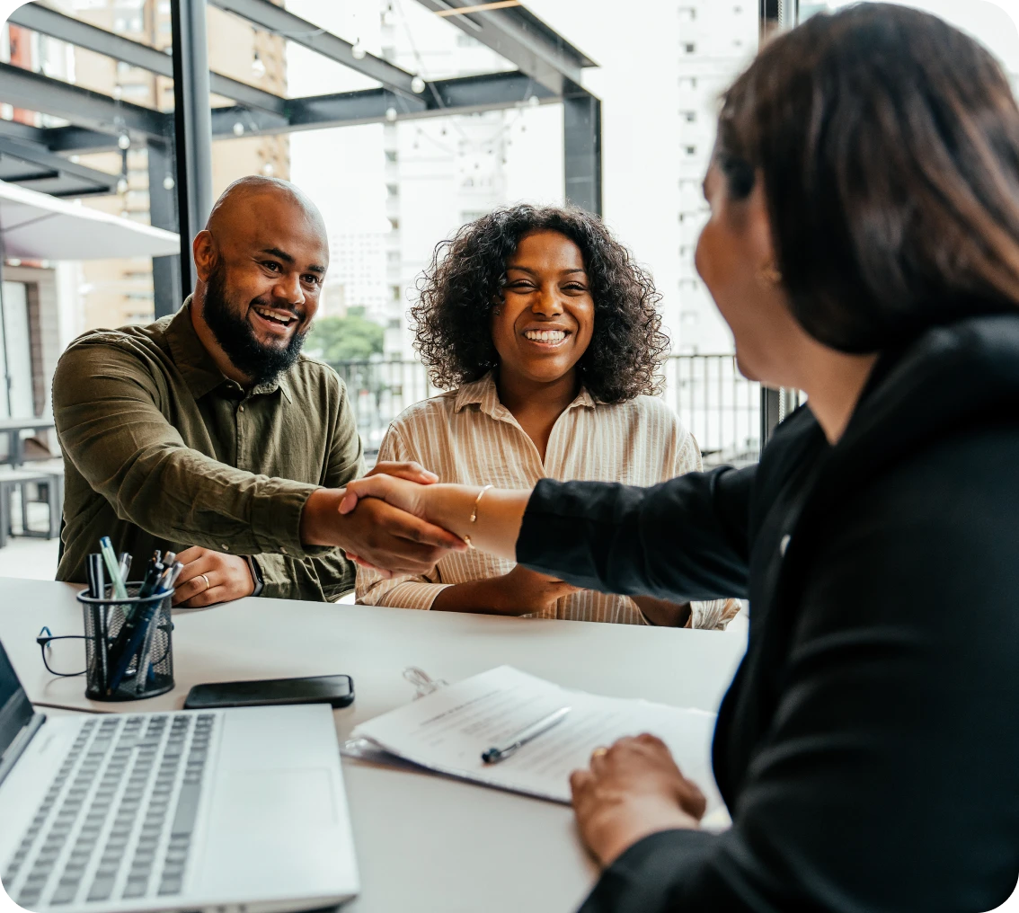 People shaking hands in a business meeting.